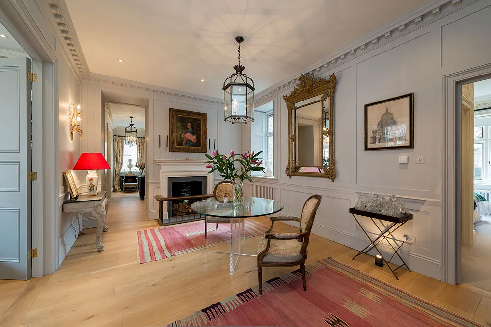 Reception room with lantern, fireplace and gilt mirror