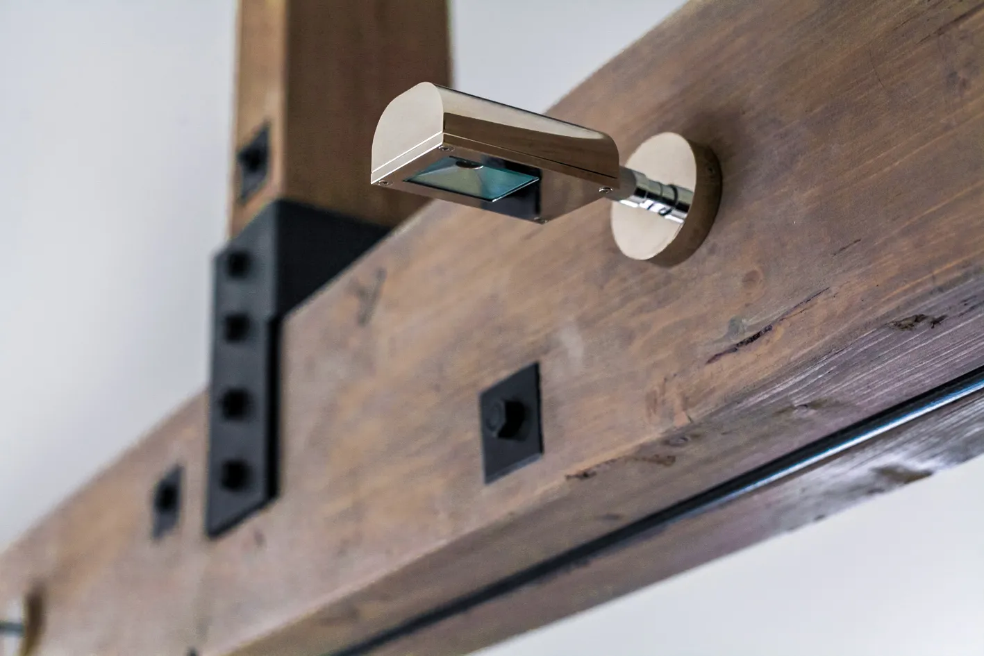Exposed timber beam with steel plate detail