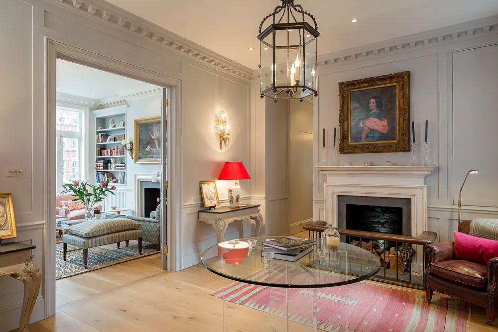 Reception room with fireplace and view through to the drawing room