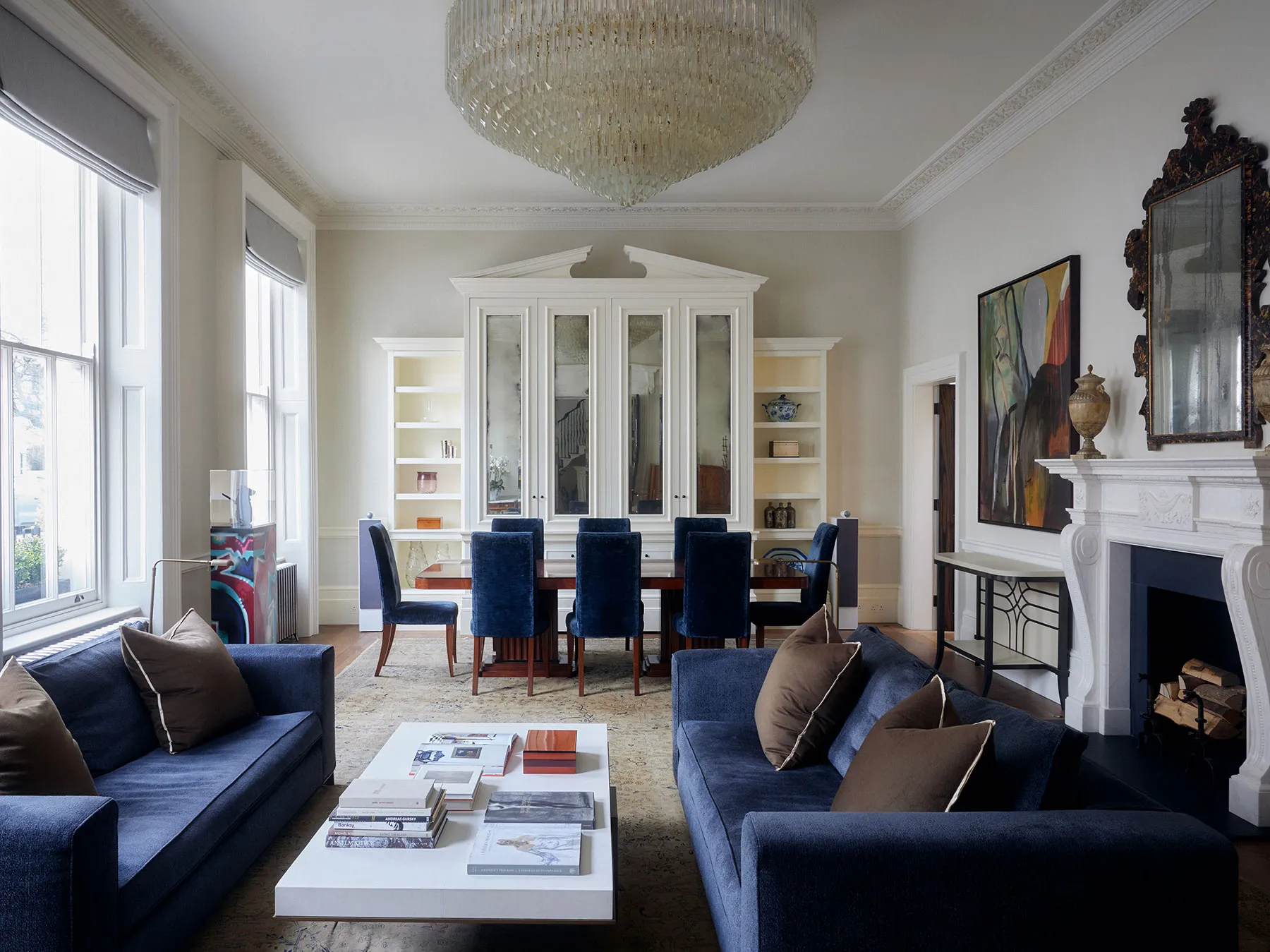 Drawing room with fireplace and dining area beyond