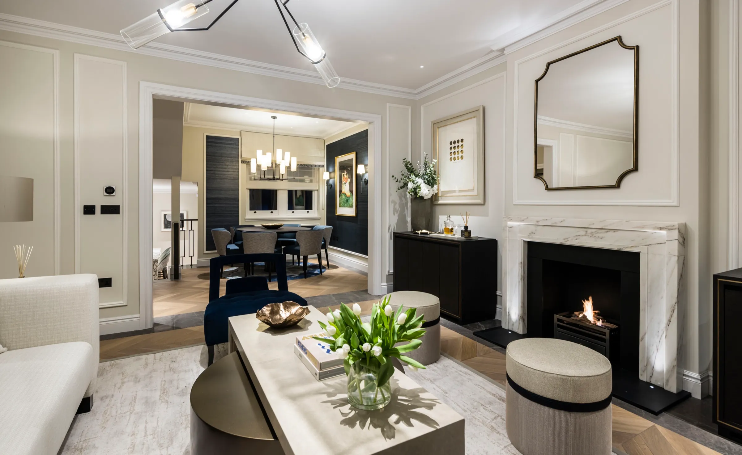 Reception room with fireplace and view through to the dining room