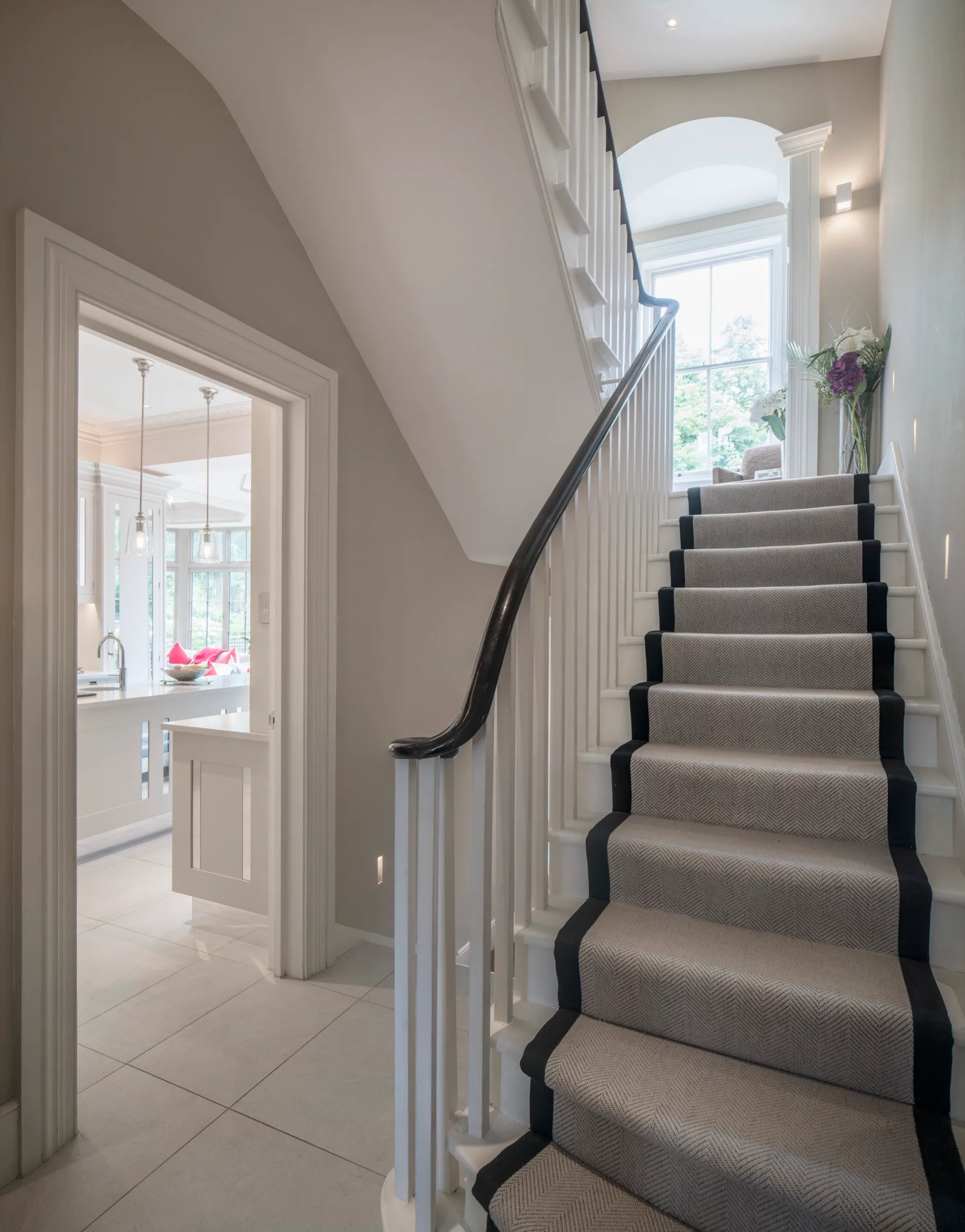 Hallway with carpeted staircase