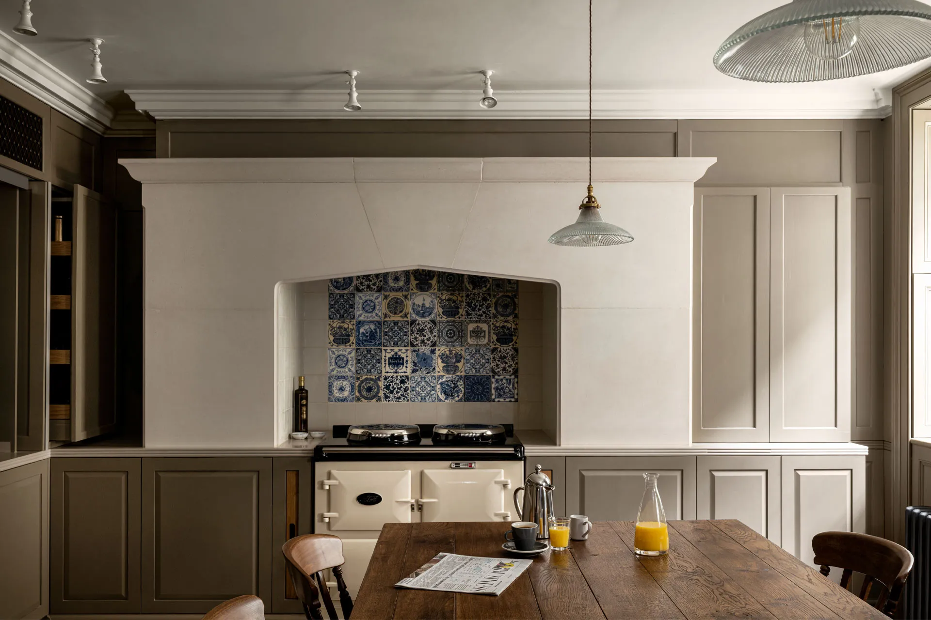 Kitchen with stone range surround and Delft tiles