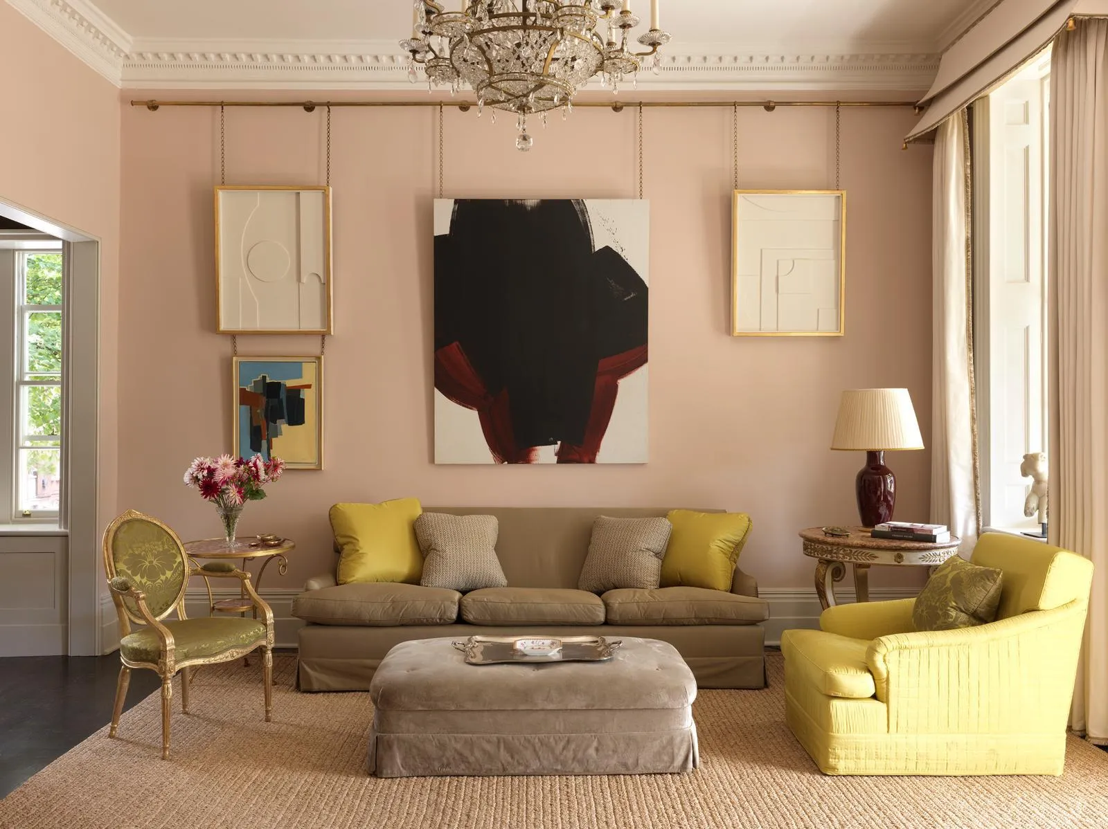 Drawing room with plaster-pink walls and period cornicing