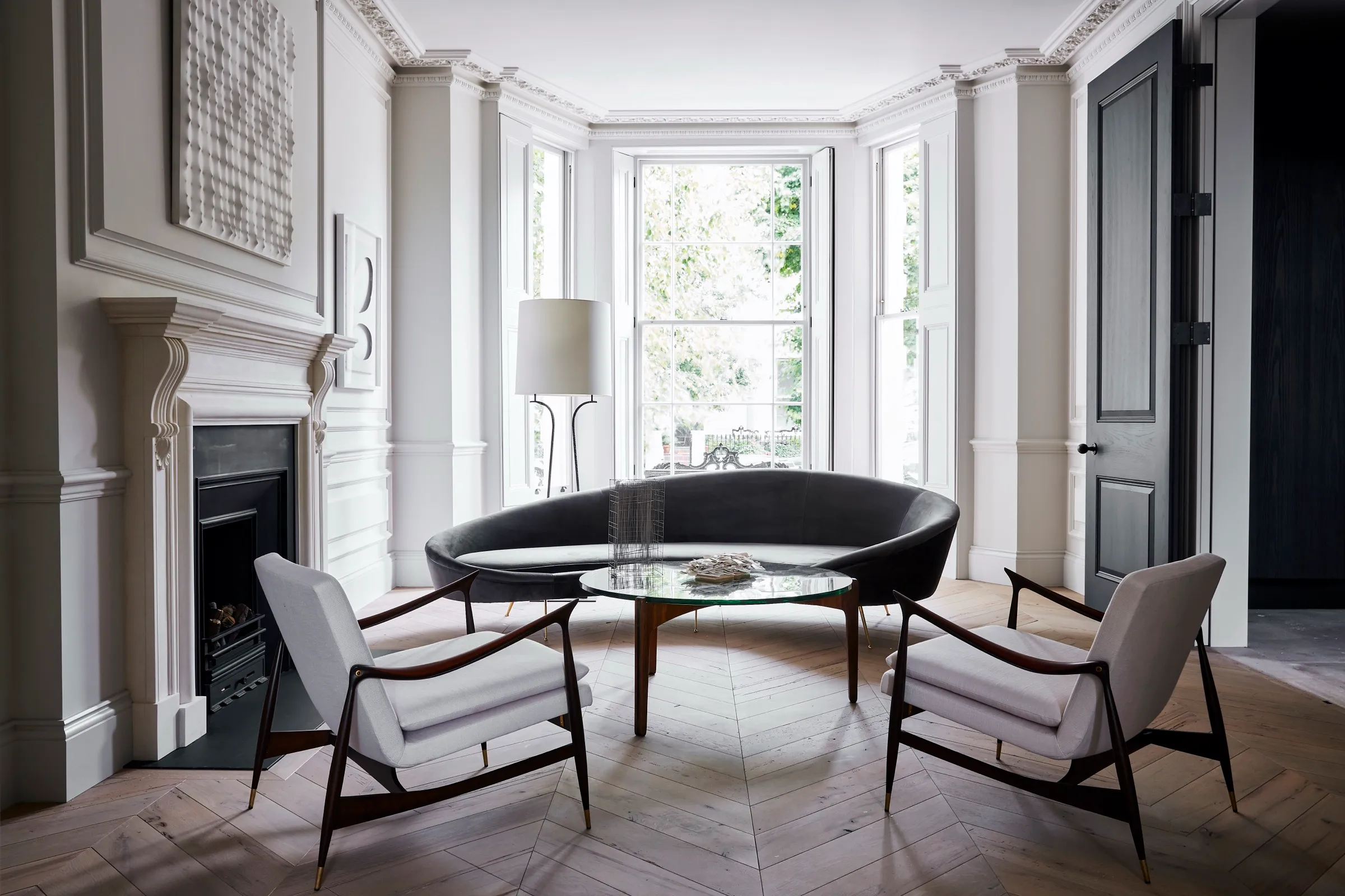 Bay-windowed reception room with panelling and fireplace