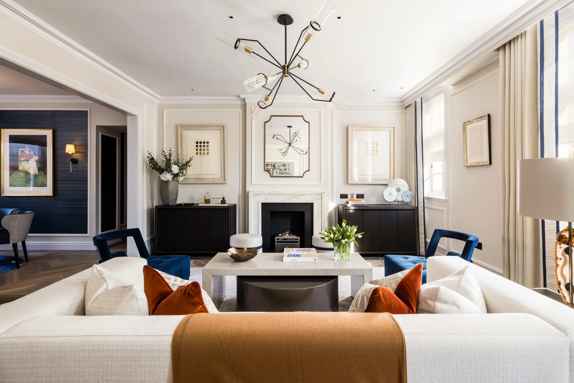 Sitting room with panelled walls and fireplace