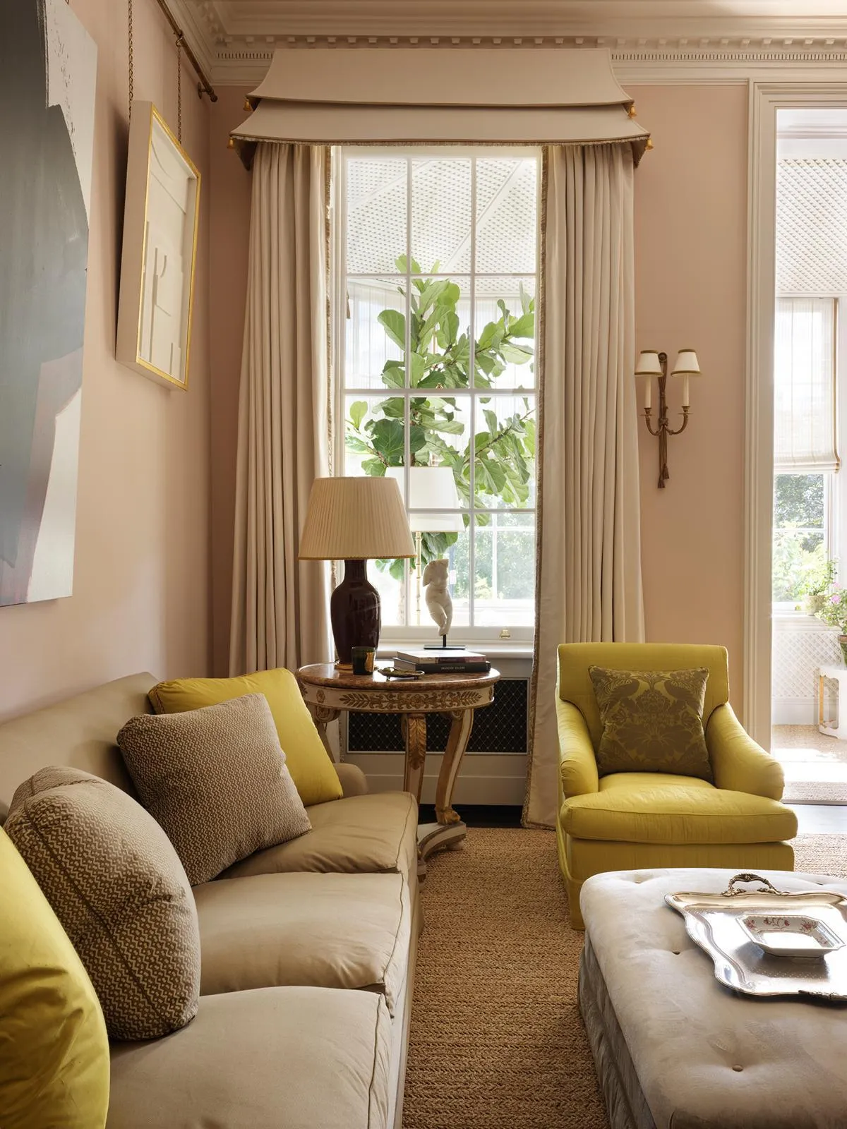 Sitting area beside a tall sash window
