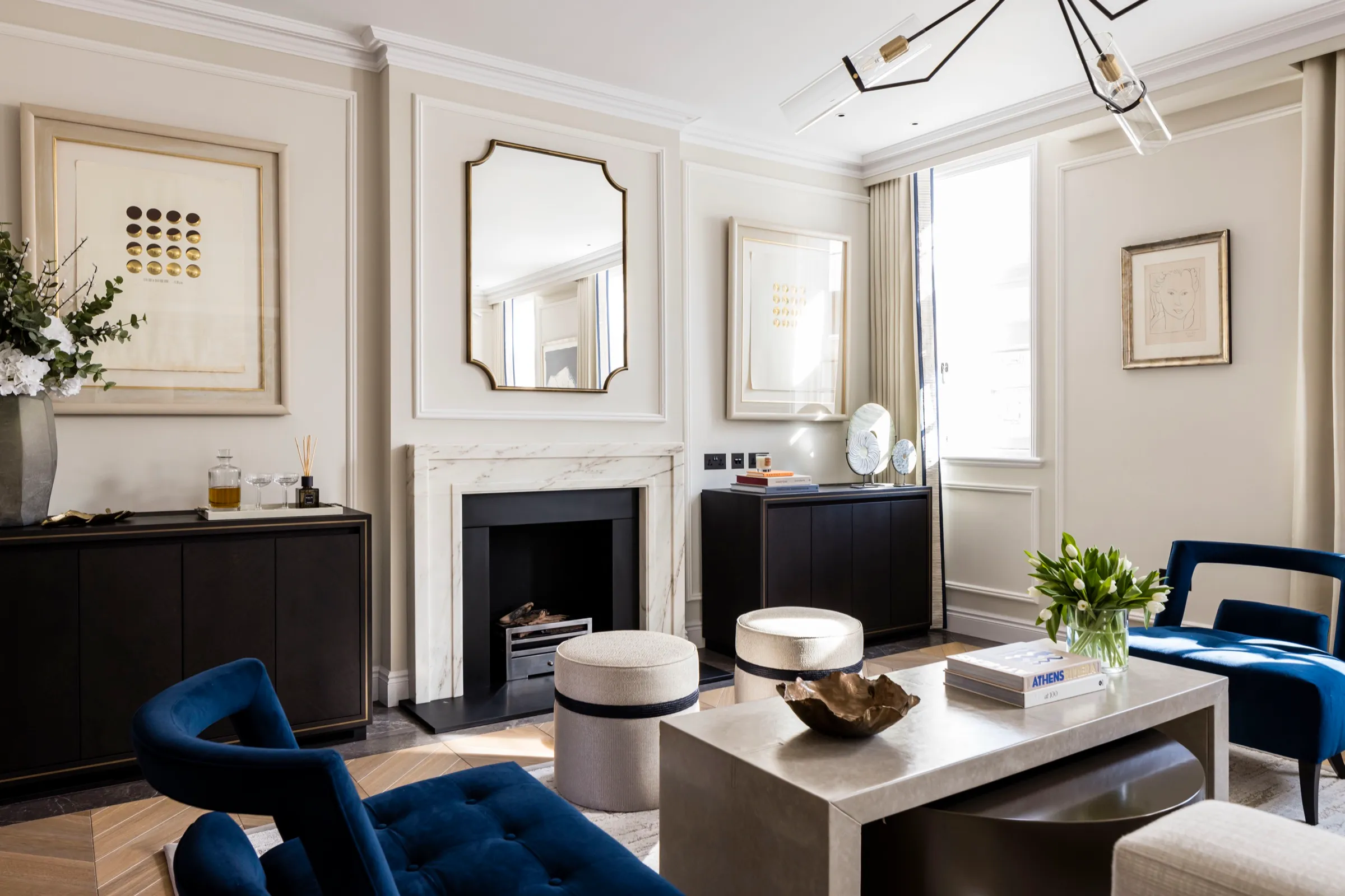Panelled reception room with fireplace and bespoke cabinetry