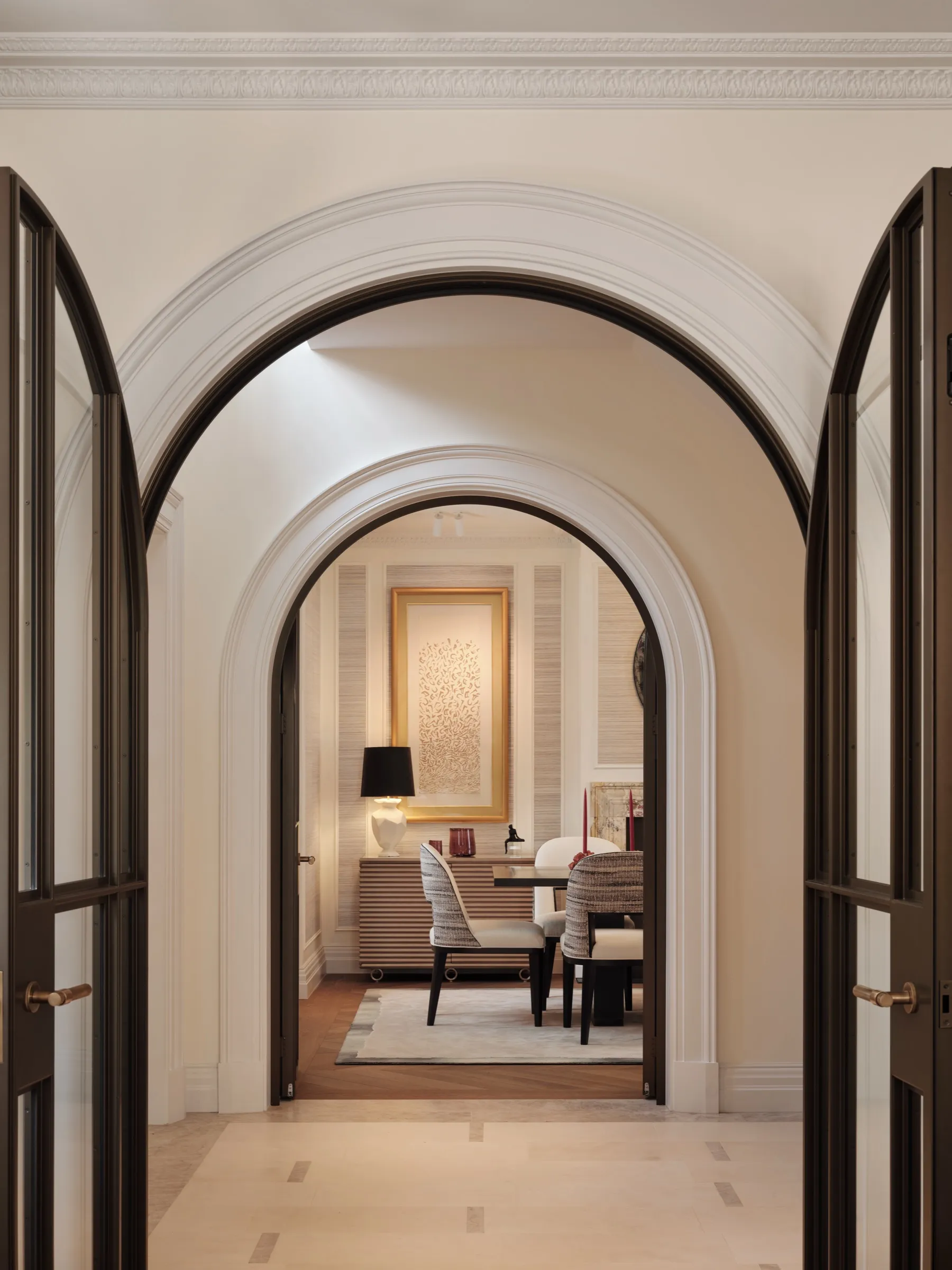 Enfilade of arched doorways with steel-framed doors