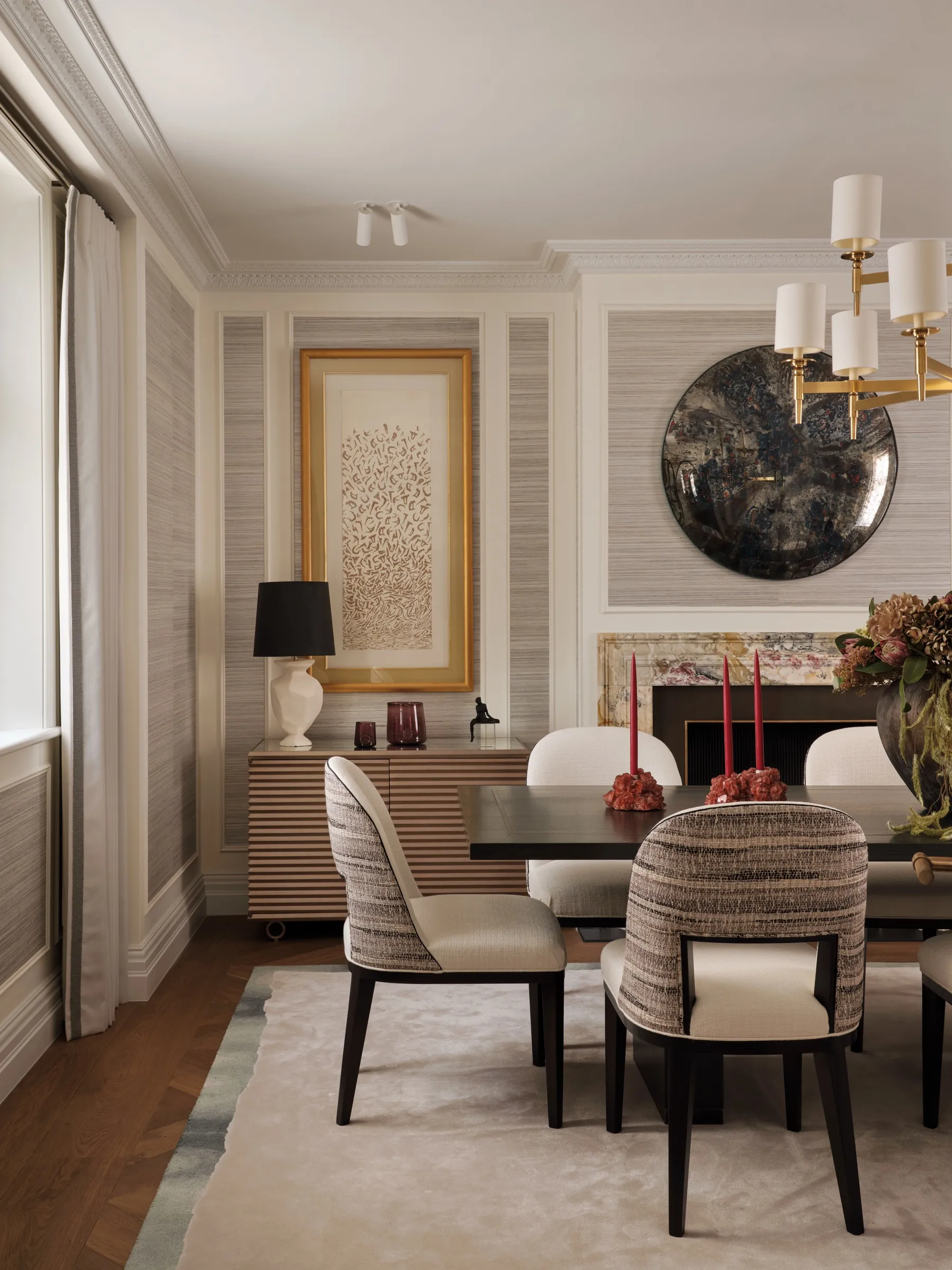 Dining room with panelled walls and fireplace