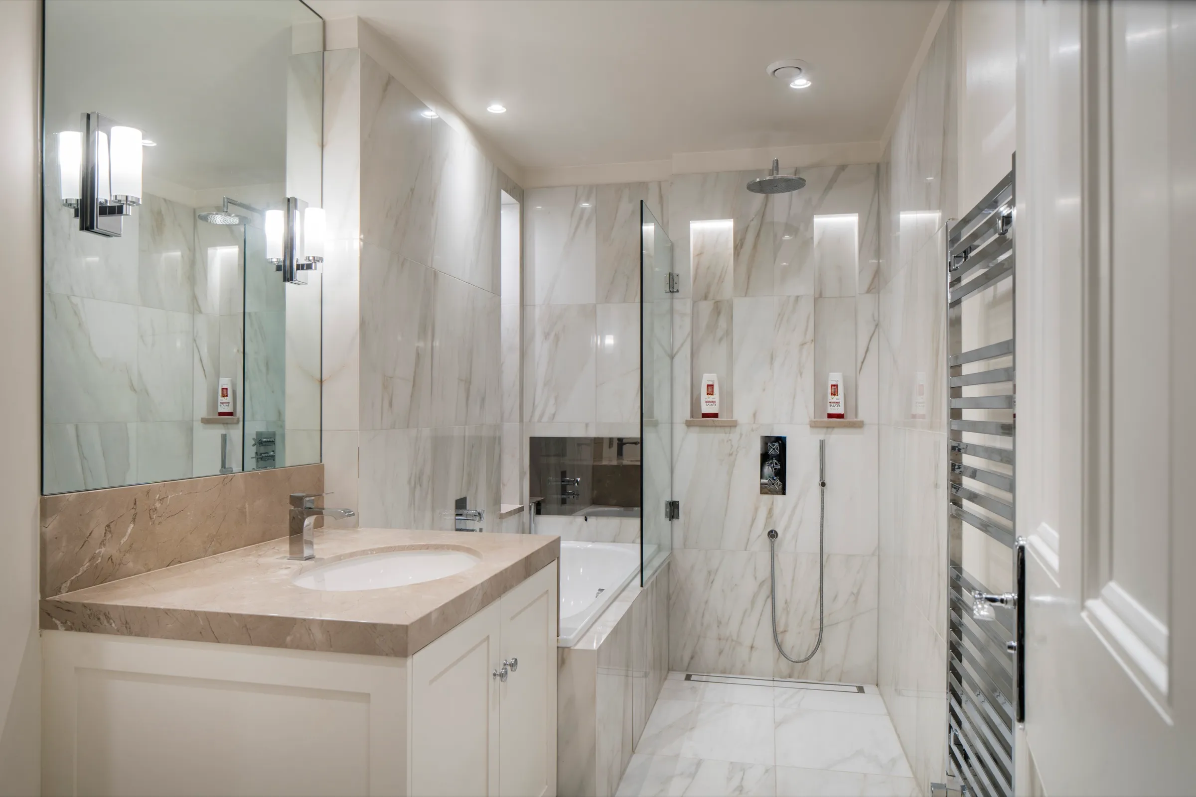 Marble bathroom with walk-in shower and vanity