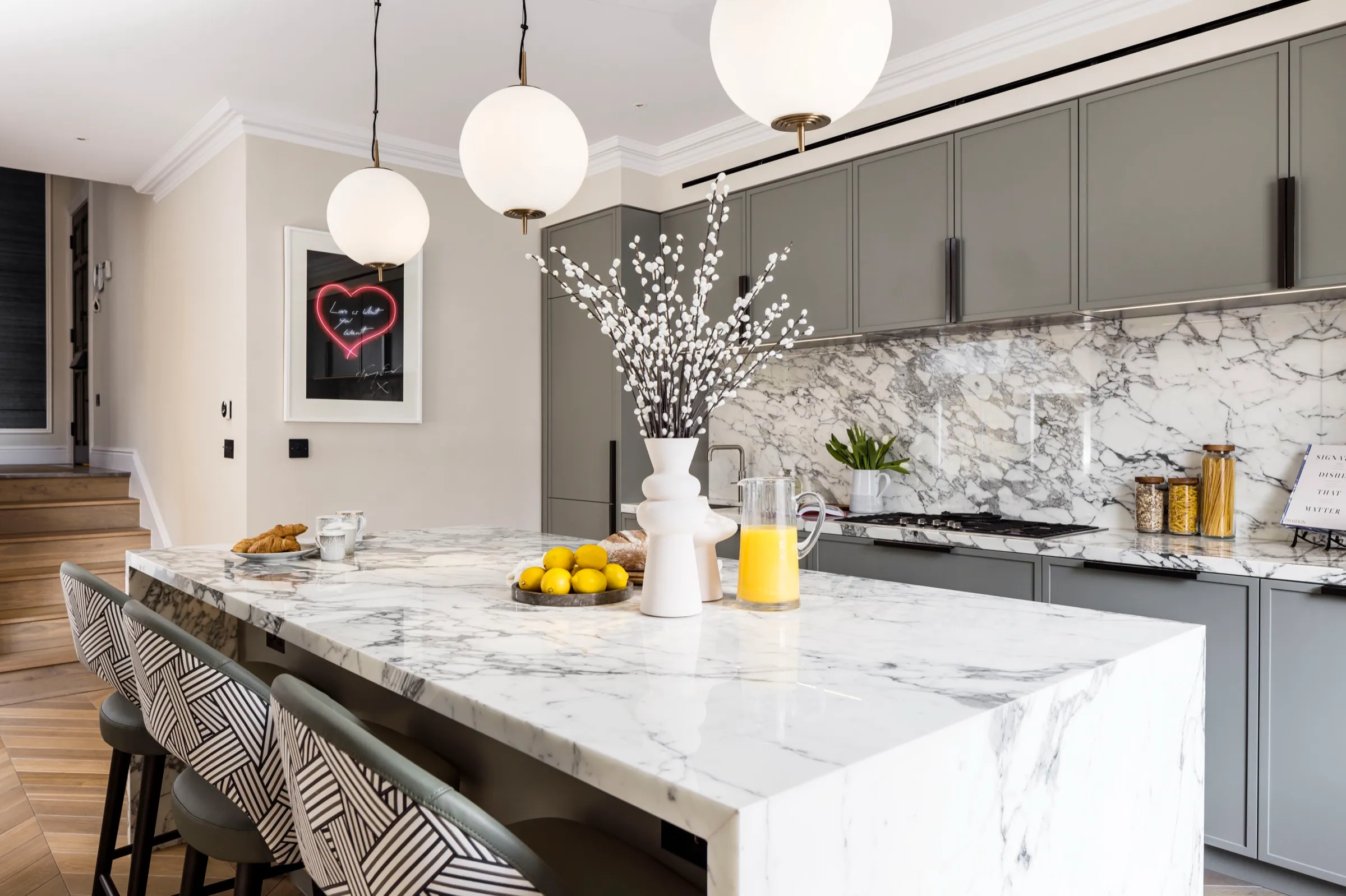 Marble kitchen island with breakfast seating
