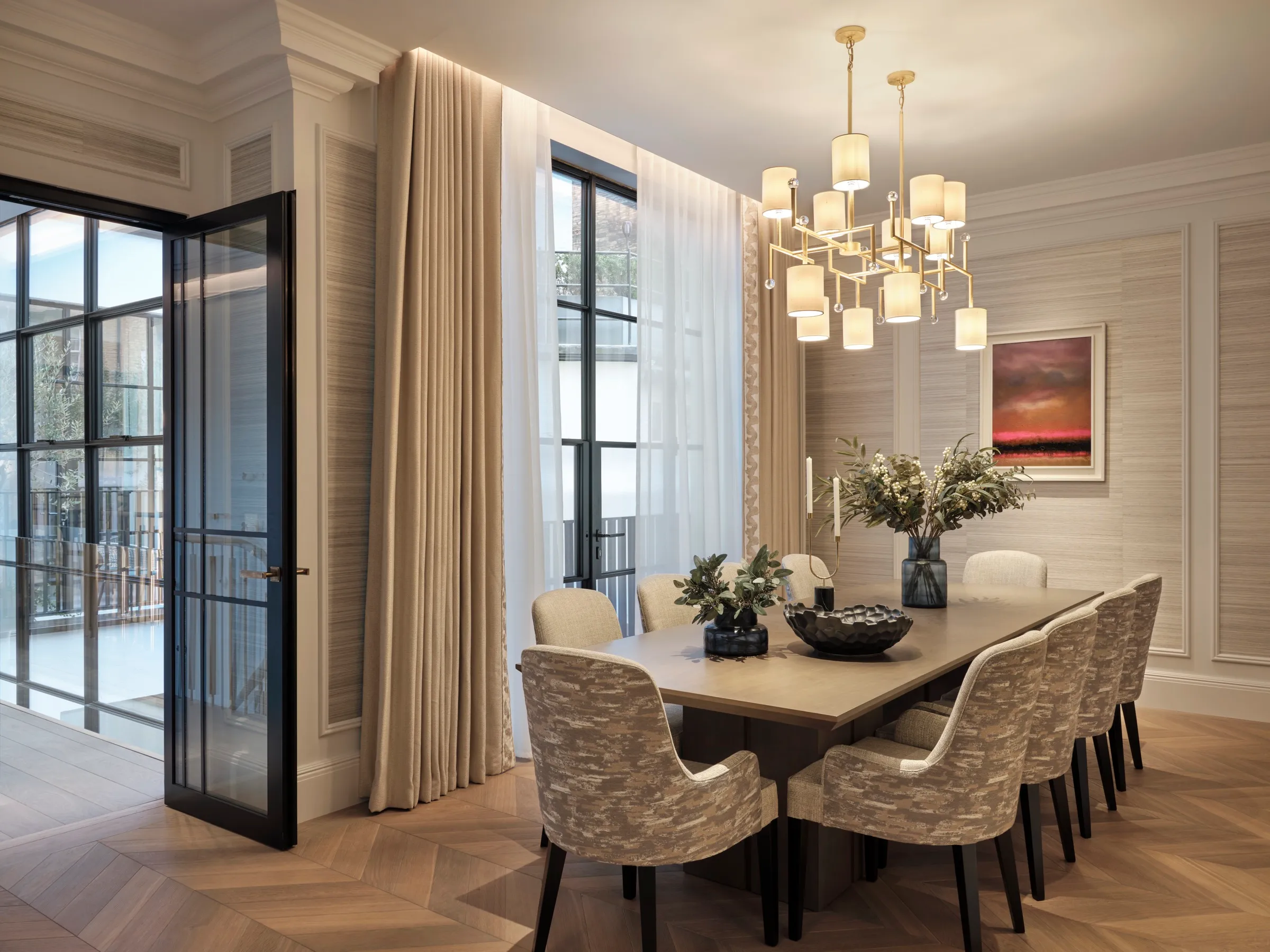 Dining room with panelled walls and steel-framed garden doors