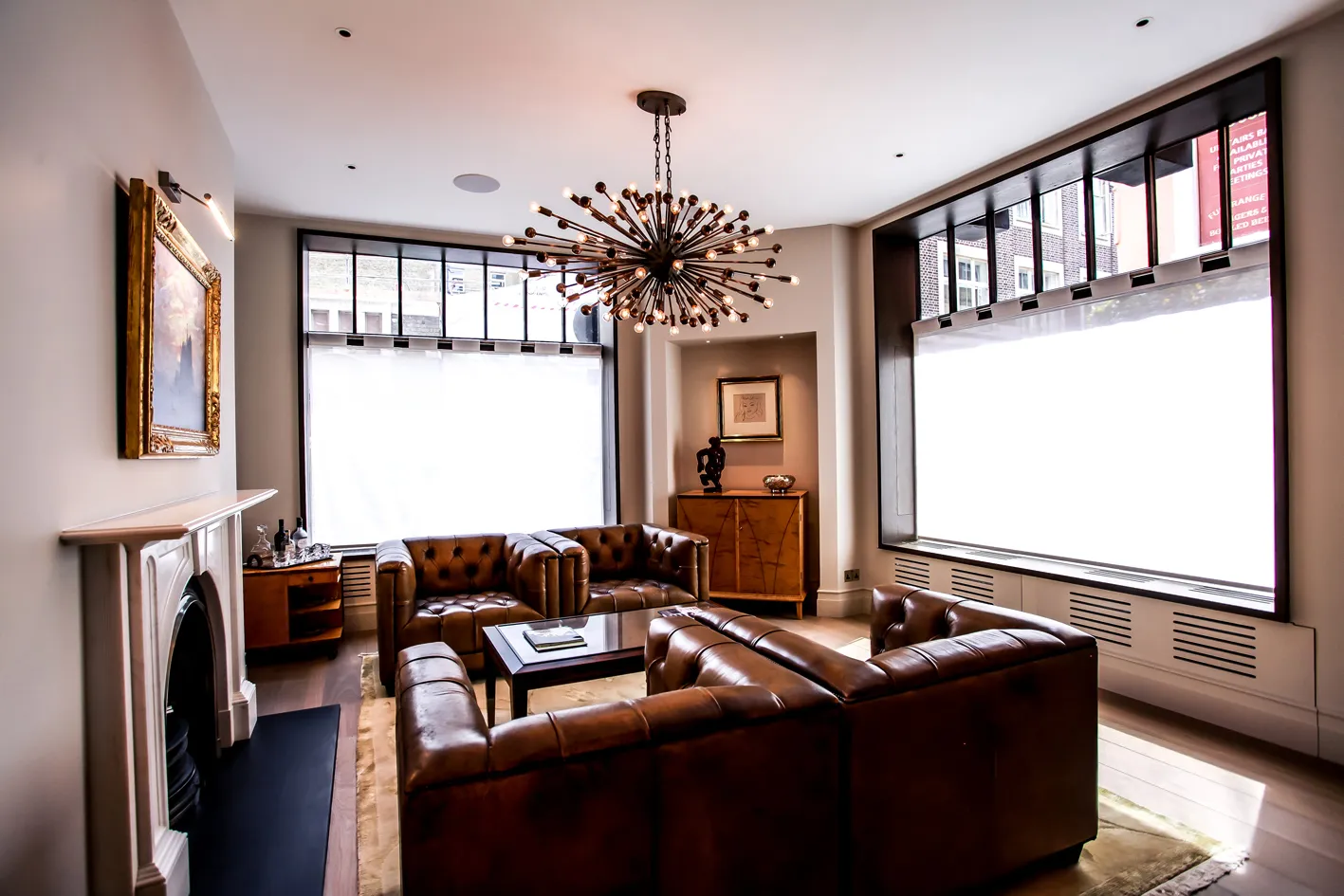 Living room with leather sofas and fireplace