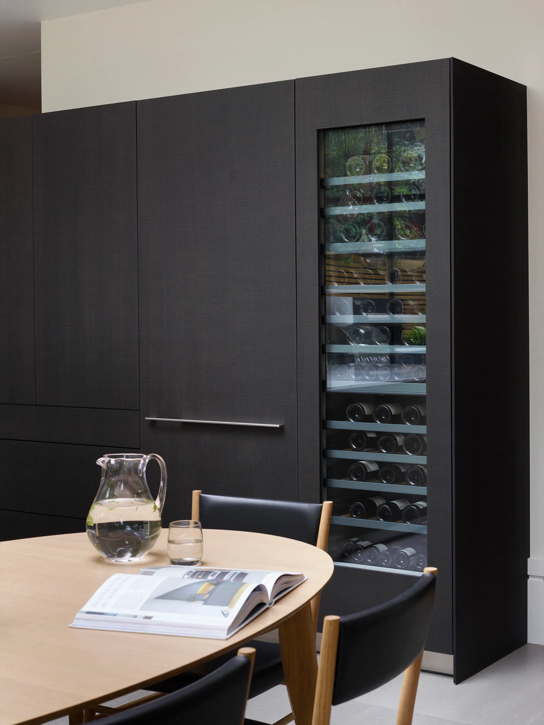 Dark timber cabinetry with integrated wine storage