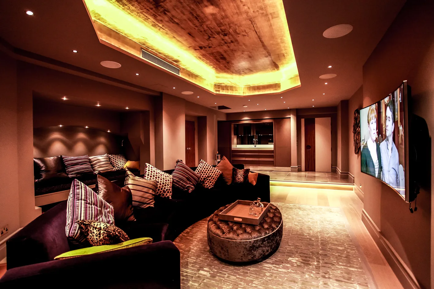 Basement cinema room with lit ceiling coffer
