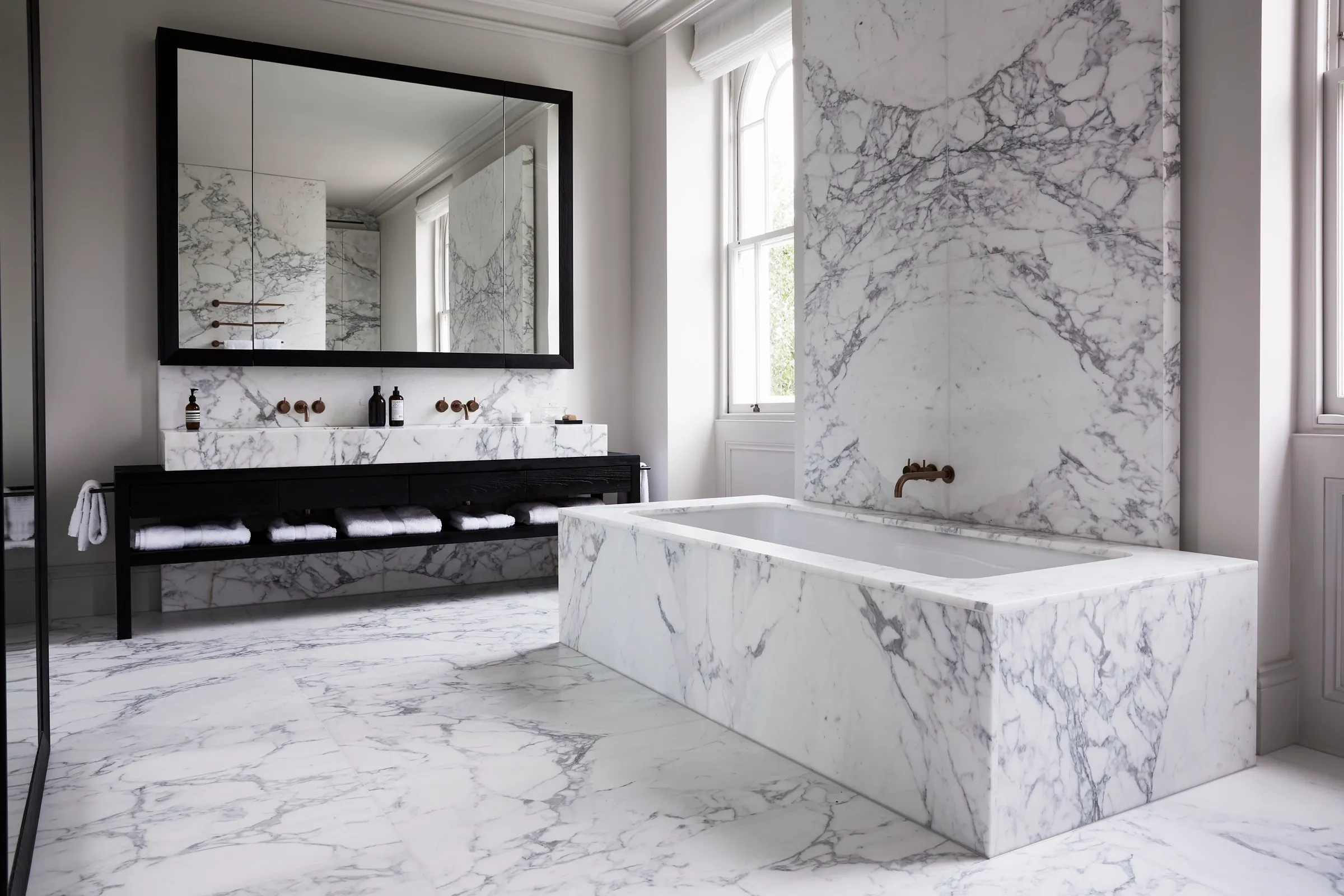 Marble bathroom with freestanding marble bath