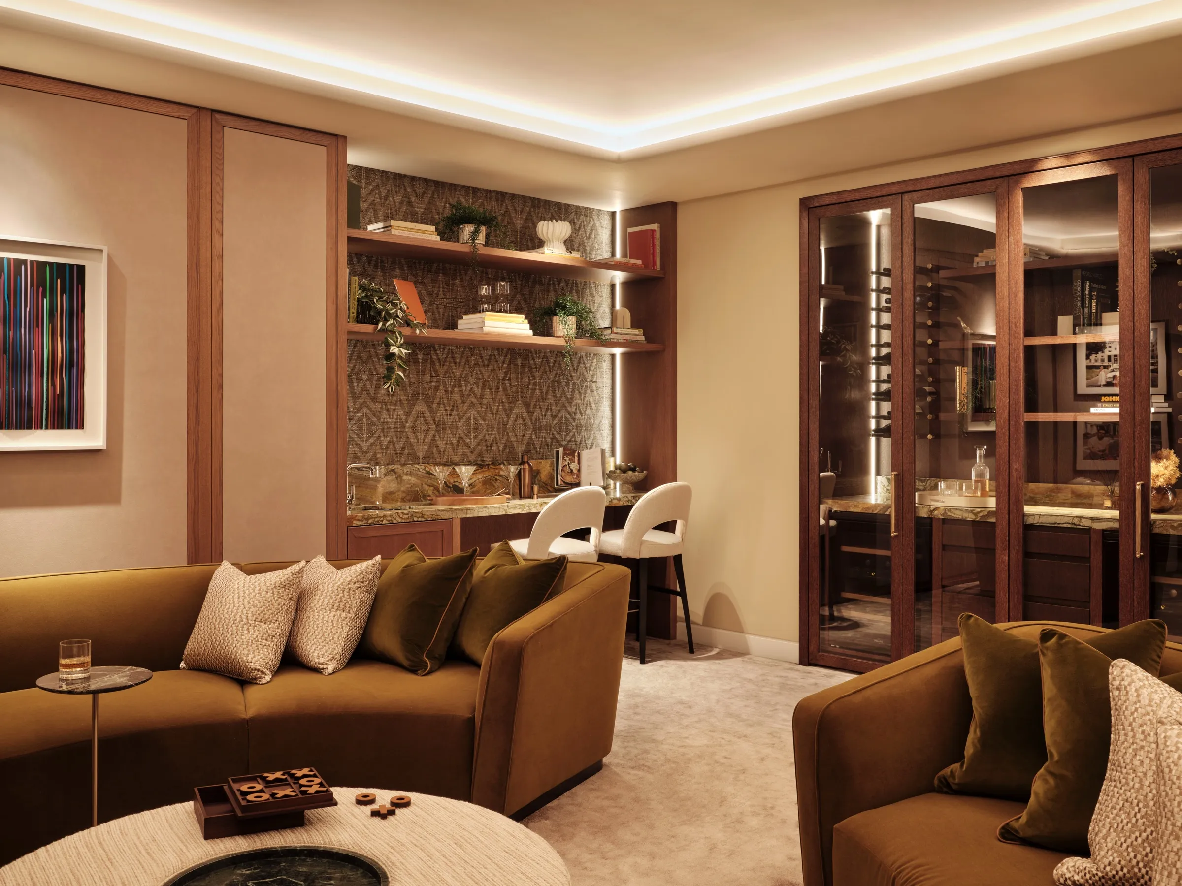 Lounge with bespoke bar joinery and glazed cabinets