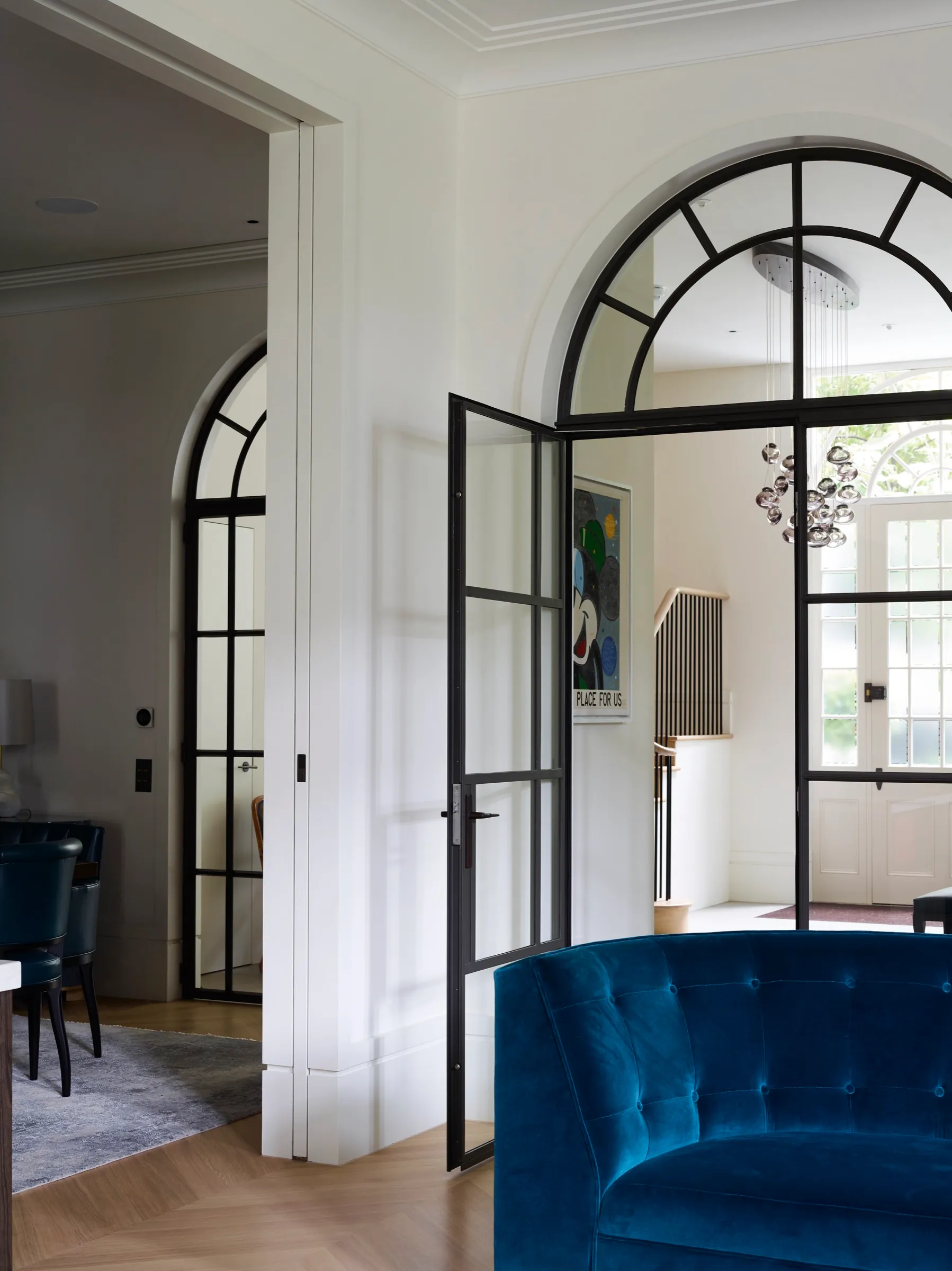Arched steel-framed doors from the living room