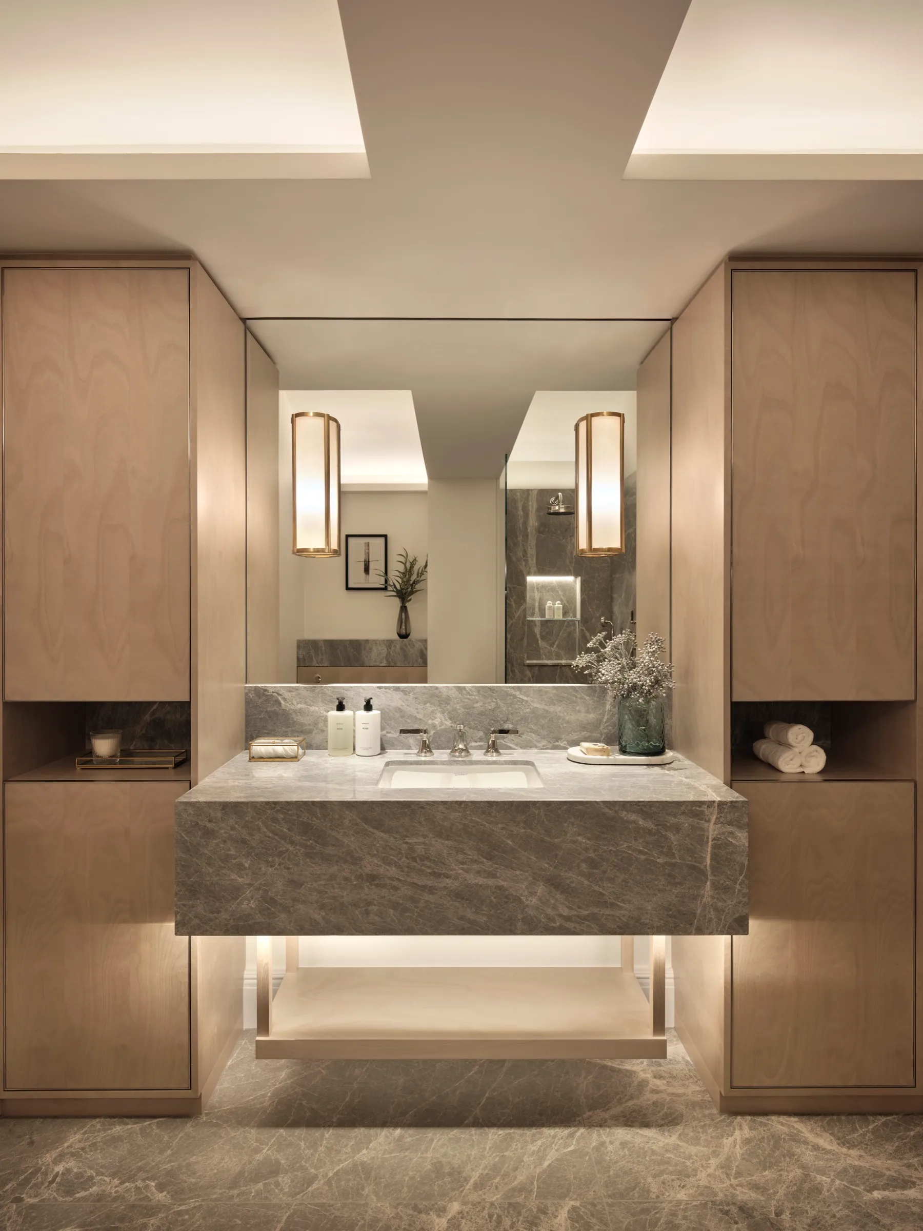 Bathroom with floating stone vanity and timber cabinetry