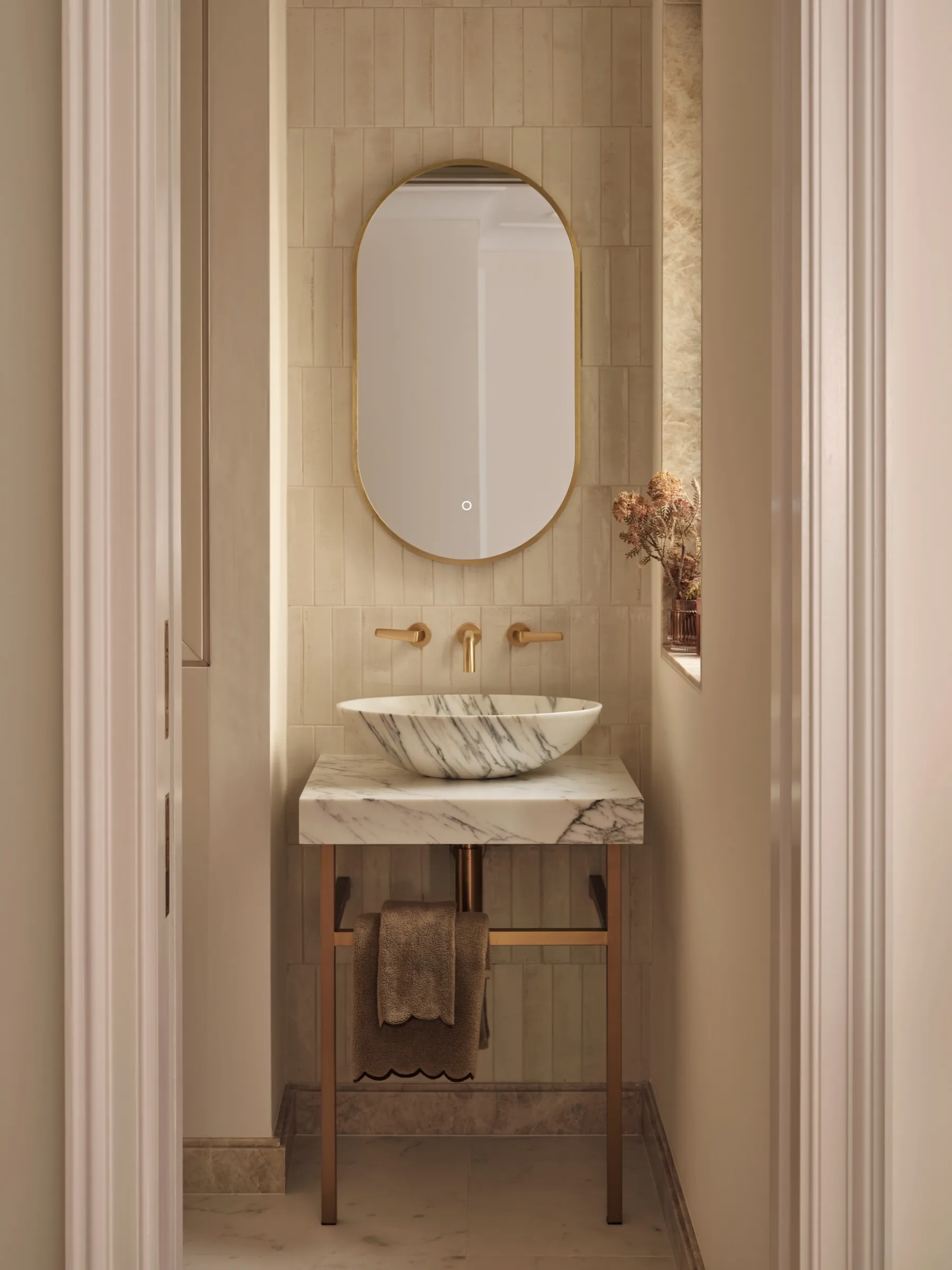 Cloakroom with marble basin and oval mirror